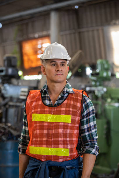 istock Portrait of a Professional Heavy Industry Engineer Worker Wearing Uniform 1321650782
