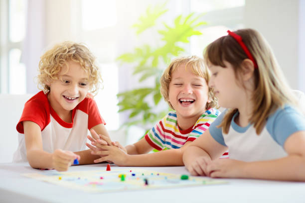 istock Family playing board game. Kids play. 1321650840