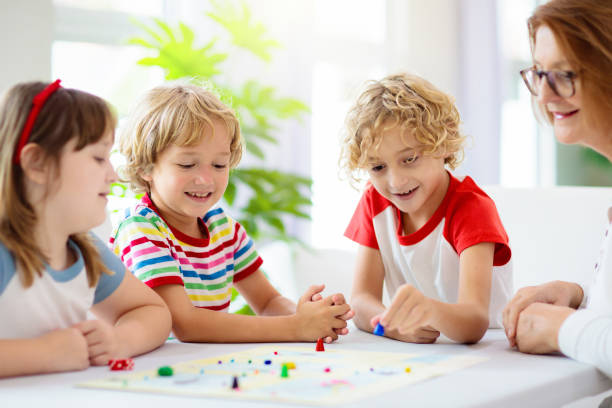istock Family playing board game. Kids play. 1321650886
