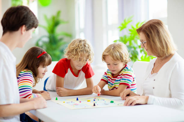 istock Family playing board game. Kids play. 1321651011