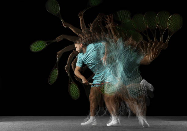 istock Stroboscope effect. One man, professional tennis player isolated on black background in mixed neon light. 1321651105