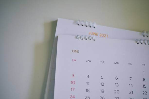 istock Blurred calendar in white tone planning 2021 concept. 1321651175