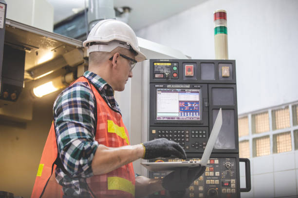 istock Engineer and worker control and check robot working in factory. The worker is controlling the robot to work in the factory. Portrait of female factory worker.  Engineer women are working with machines cnc 1321651356