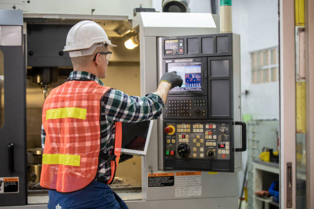 istock Engineer and worker control and check robot working in factory. The worker is controlling the robot to work in the factory. Portrait of female factory worker.  Engineer women are working with machines cnc 1321651414