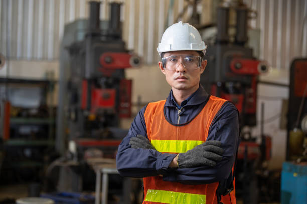 istock A asian male construction engineer at construction site. man of skillful factory workers using machine equipment in workshop. 1321651499