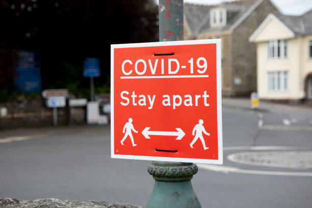 istock Social distancing sign on a lampost 1321655239