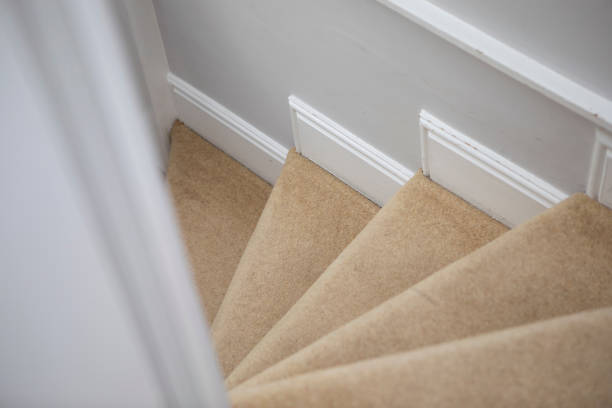 istock Looking down a spiral staircase, with beige coloured carpet 1321655778