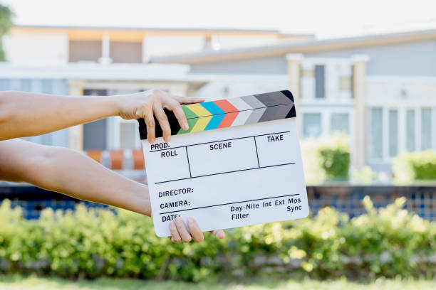istock Hand holding film slate colors board 1321659181