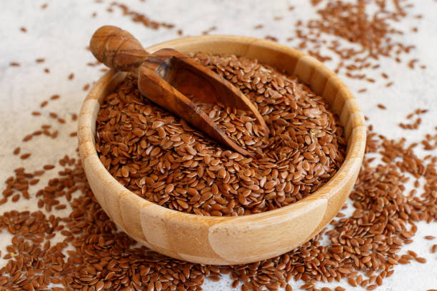 istock Raw Flax seeds in a bowl with a spoon 1321660901