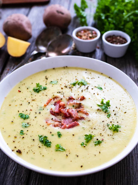 istock Cream potato soup with bacon on wooden table 1321661397