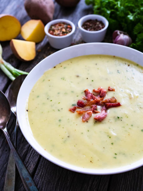 istock Cream potato soup with bacon on wooden table 1321661452