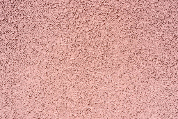 istock The rough surface of the light pink concrete wall 1321662436
