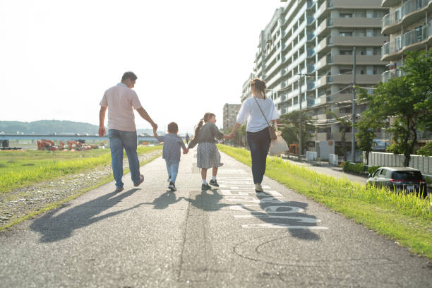 Rear view of family walking together