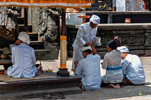 May 8, 2014.  Pura Besakih Temple, Bali, Indonesia.\n\nLocated on the slopes of Mount Agung Volcano, Pura Besakih is the most important hinduist temple in Bali.\n\nOne priest is conducting a blessing ceremony.