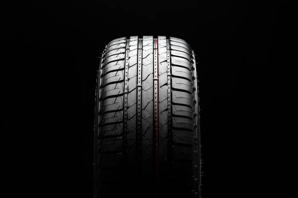 istock new summer tire, tread close-up on black background 1321668976