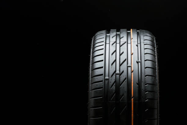 istock new summer tire, tread close-up on black background 1321669010