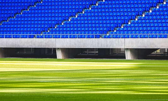 Grass field and seats in football stadium
