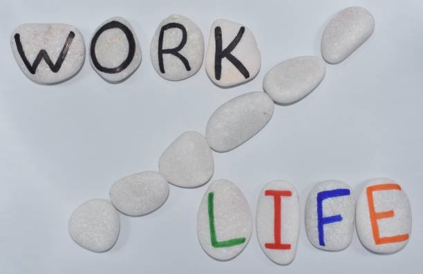 istock Work life balance represented in text on white stones 1321672440