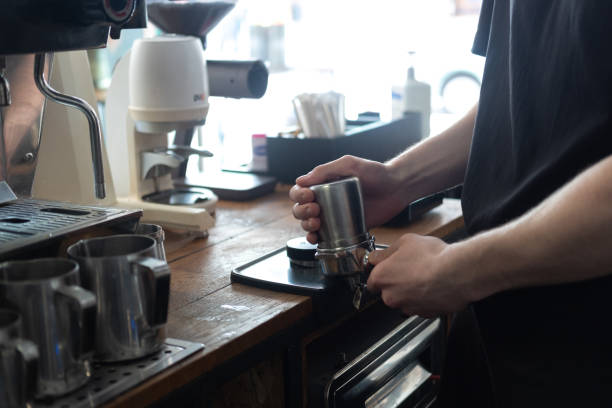 istock Barista faceless make coffee latte art with espresso machine in cafe 1321675954