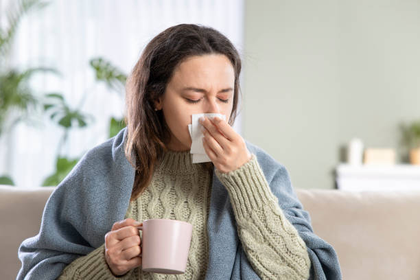 istock Sick desperate young woman blowing the nose 1321676296