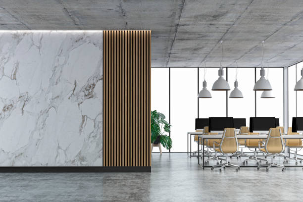 istock Empty office interior with copy space and wordesks on concrete floor 1321677312