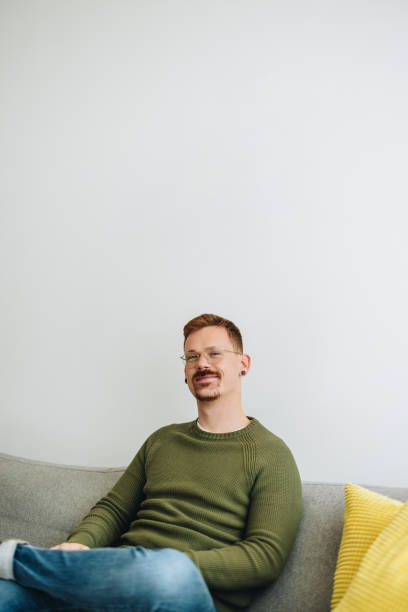 istock Businessman sitting in lobby 1321677392