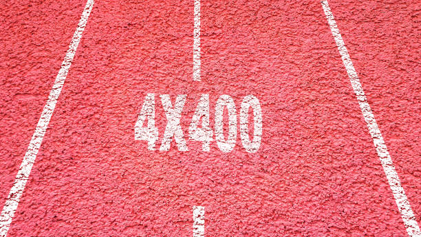 istock Red athletic and running track with text 4x400 concept 1321678827