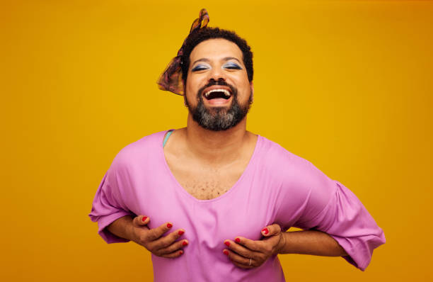 istock Drag queen posing on yellow background 1321678851