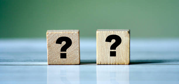 istock Quiz concept symbol with question mark on wooden cube blocks. Support or questionnaire background pattern 1321679251