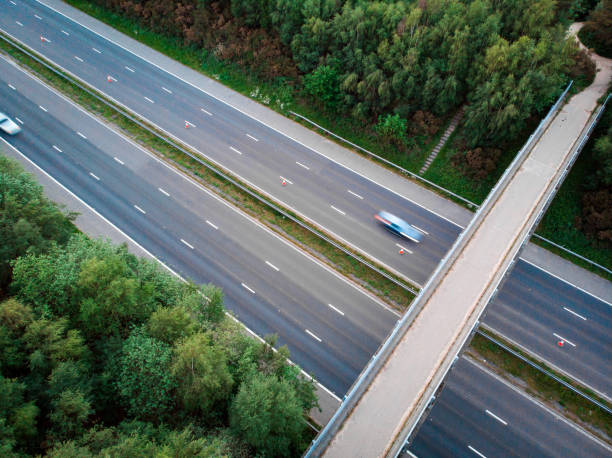 istock Blurred motion of traffic on highway from above 1321679486
