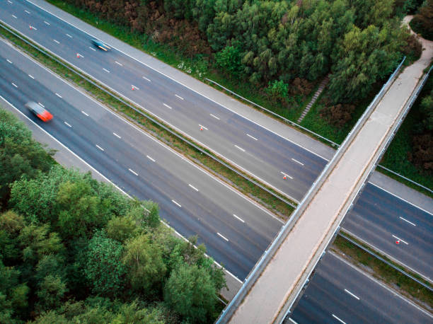 istock Blurred motion of traffic on highway from above 1321679487