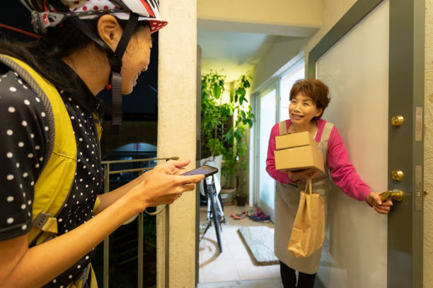 istock Receiving parcel at door 1321680359