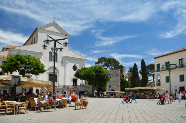 The old town of Ravello, Italy Ravello, Italy, 05/19/2017. Tourists relaxing in the square of a town on the Amalfi coast. ravello stock pictures, royalty-free photos & images