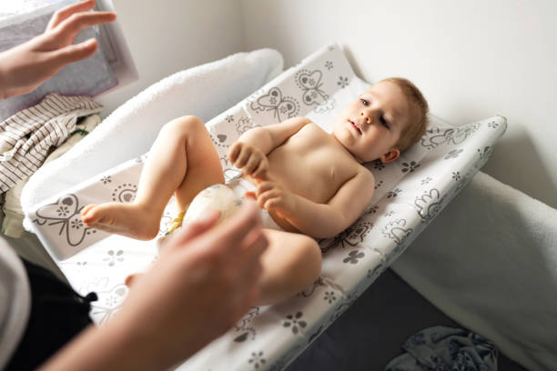 istock An unrecognizable mother changing a diaper to her baby son 1321688646