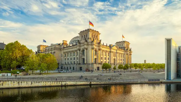the reichstag building of berlin while sunset
