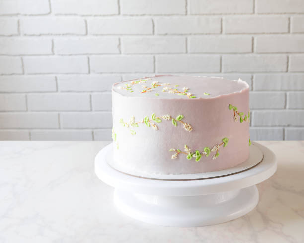 istock Wedding pink cake on a stand. delicate decor on cake 1321688971