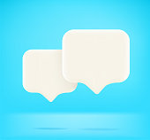 istock Two speech balloons with copy space. Dialog concept on blue background 1321692600