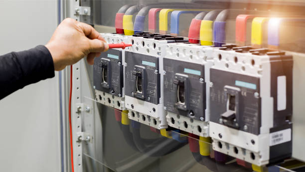 istock Electrical engineer tests the operation of the electric control cabinet on a regular basis for maintenance. 1321692816