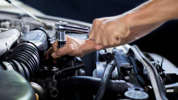 istock Car mechanic working on car engine, car maintenance concept. 1321692924
