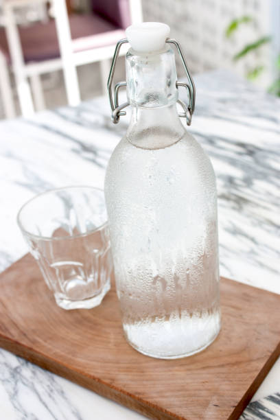 istock Bottle and glass of water 1321697473