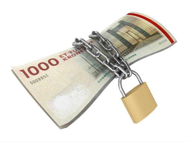 istock Danish krone falling money finance safe protection lock 1321697885