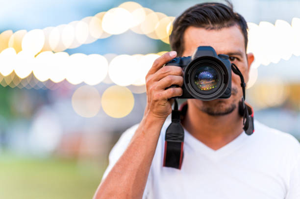istock Man photographer Taking Photos At bokeh Night 1321697899