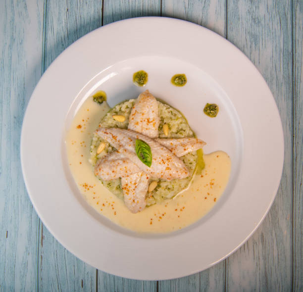 istock Baked sole fillet, risotto and pesto recipe 1321700546