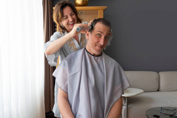 istock Couple enjoying cutting hair at home during COVID-19 quarantine 1321704795