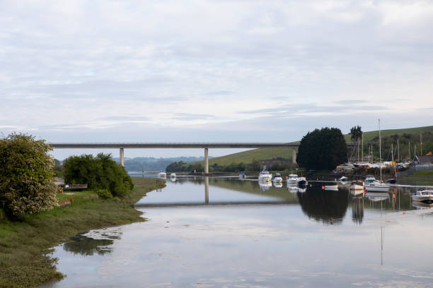 istock Bridge over the River Camel, with boats moored, early morning 1321705414