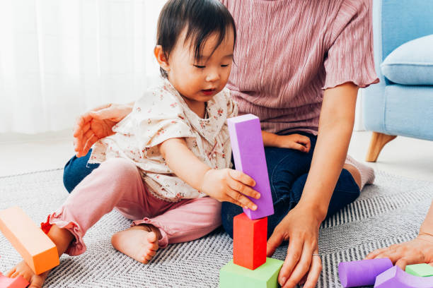 istock Mother playing at home with baby 1321705997