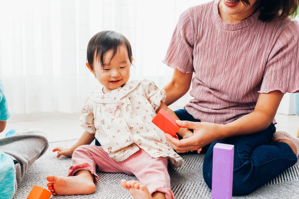 istock Mother playing at home with baby 1321706005