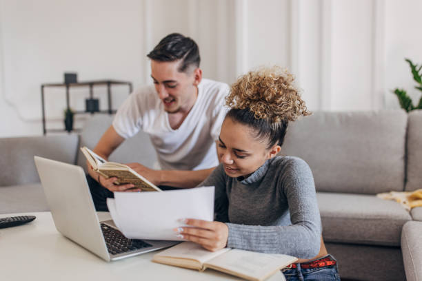 istock Couple studying together at home 1321706159