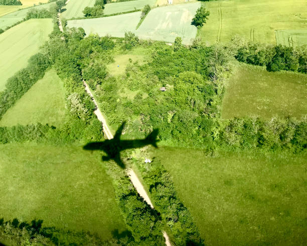 istock Plane shadow on a french countryside 1321708400