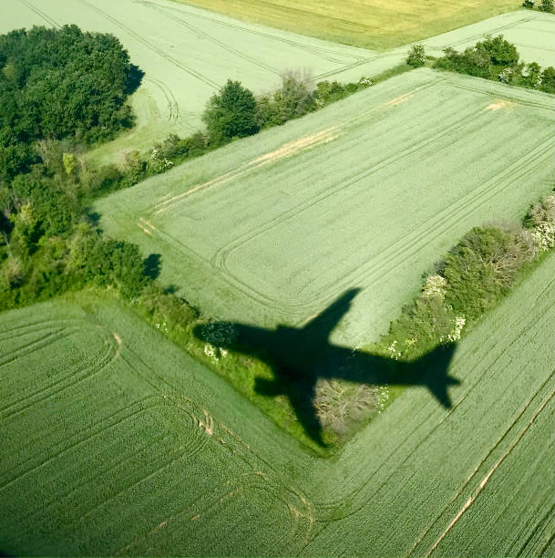 istock Plane shadow on a french countryside 1321708423